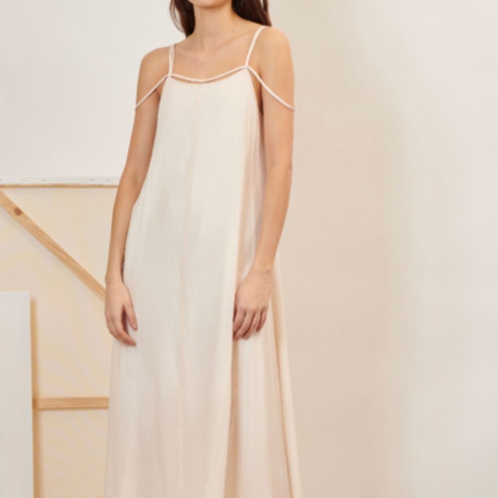 Cream colored midi slip dress with strap detail